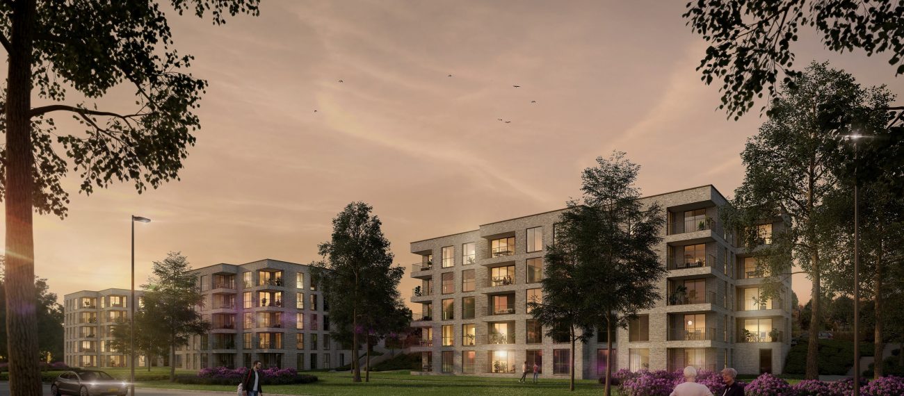 Impressie van het nieuwbouwproject De Jonkvrouw in Geldrop, met warme avondzon die de gevel van het appartementencomplex verlicht.