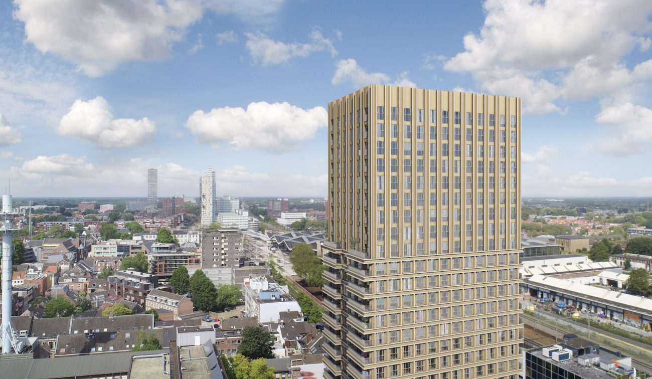 Goudkleurige toren met verticale lamellen aan de spoorzone, skyline Tilburg — Nieuwbouw De Bankier Tilburg