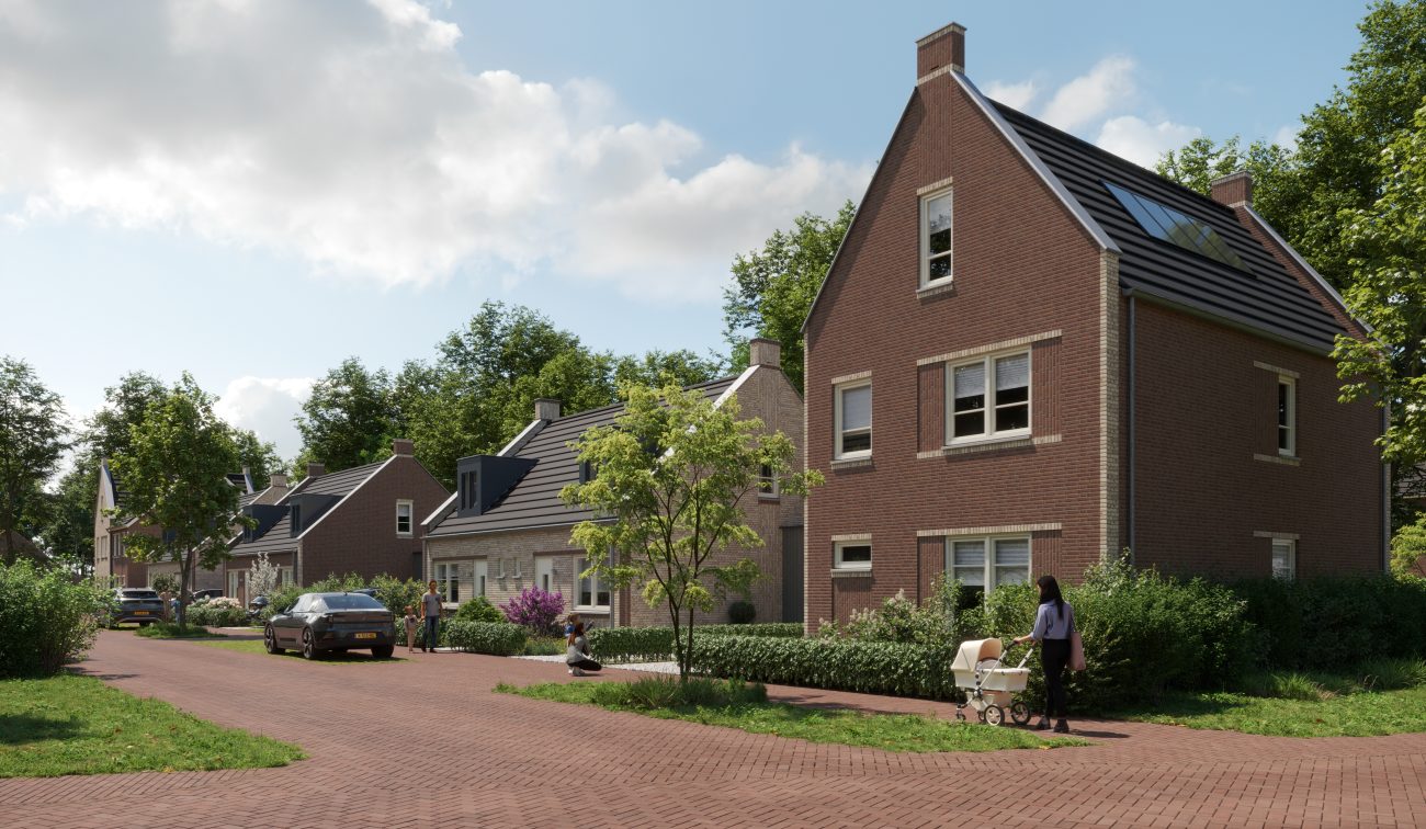 Vrijstaande bakstenen woningen in Bosrijk Mariendaal (Velp) langs rood klinkerwegdek; groenstroken, geparkeerde auto’s en wandelaar met kinderwagen, zonnige dag.