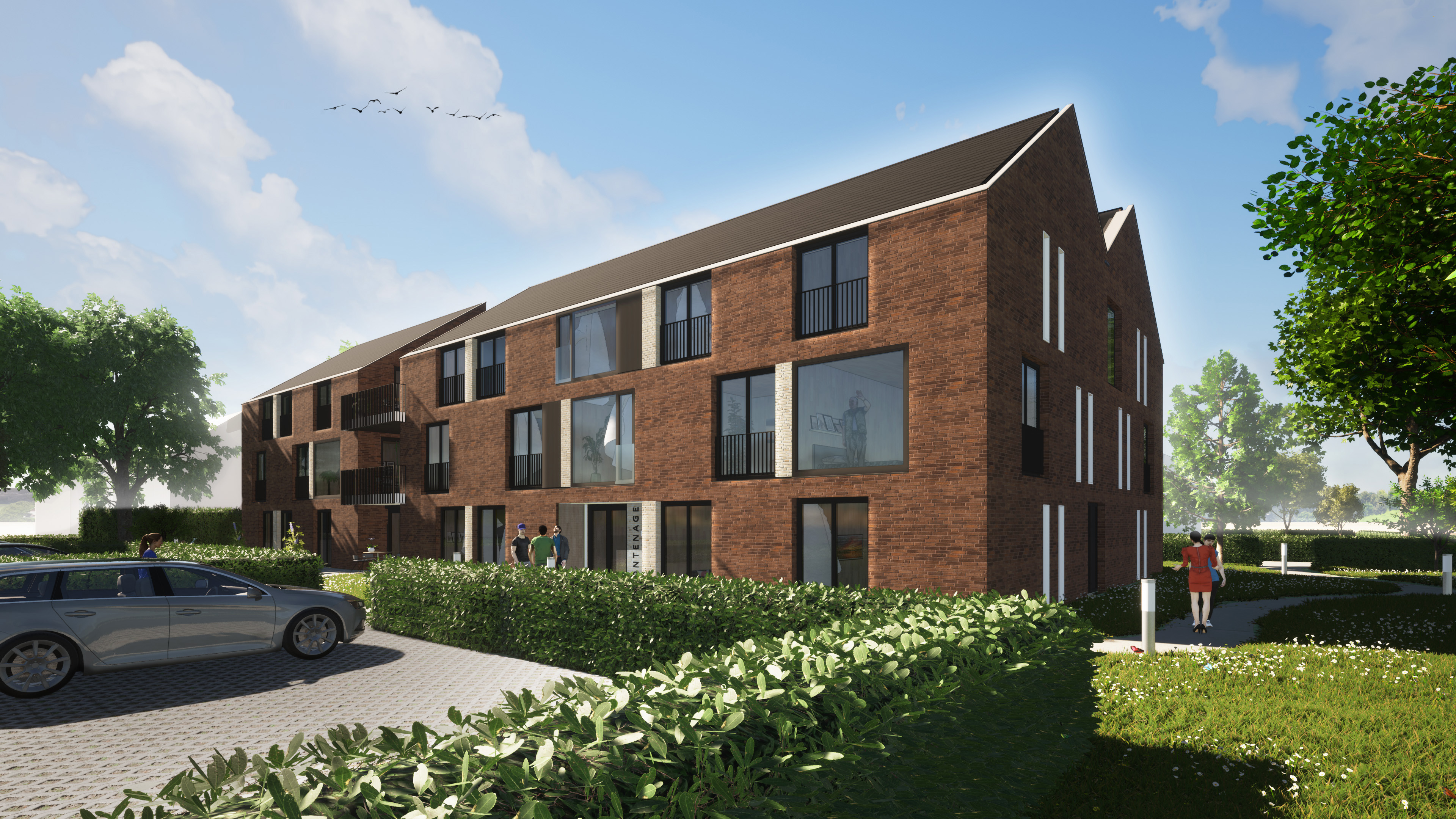 Appartementencomplex met bakstenen gevel, balkons en groene buitenruimte rond entree