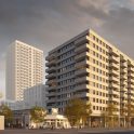 Close-up impressie van de nieuwbouwtoren bij het TAC-terrein in Eindhoven, met moderne gevels, balkons en een warme avondlichtinval.