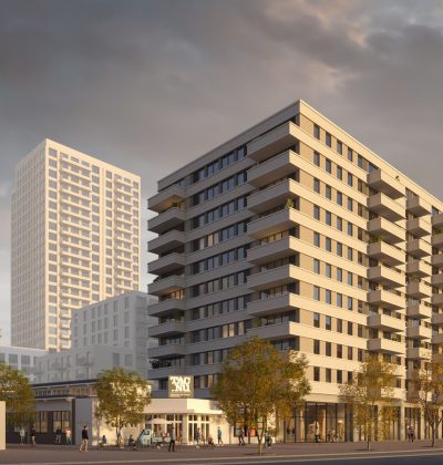 Close-up impressie van de nieuwbouwtoren bij het TAC-terrein in Eindhoven, met moderne gevels, balkons en een warme avondlichtinval.