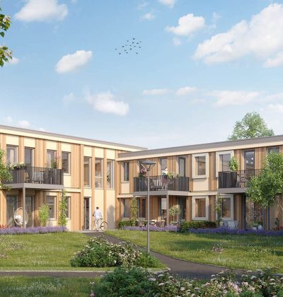 Woningbouw rond groene binnentuin met balkons, wandelpaden en bomen