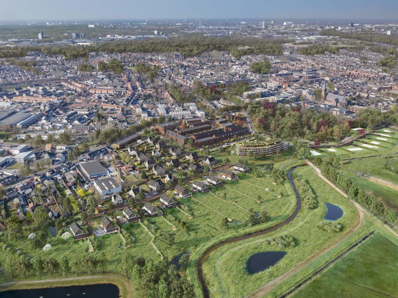 Luchtfoto van het gebied in Goirle vóór de start van het nieuwbouwproject Land van Anna, met zicht op het bestaande landschap en omliggende bebouwing.