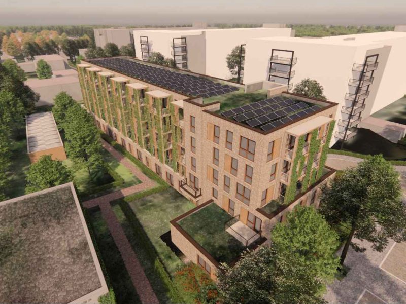 Luchtbeeld van het nieuwbouwproject aan de Hertoglaan in Vught met duurzaam ontworpen gebouw, groene gevels en parkachtige omgeving.