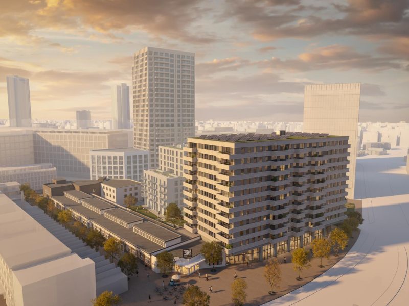 Impressie van de nieuwbouwtoren bij het TAC-terrein in Eindhoven, een modern appartementengebouw in stedelijke omgeving met hoge torens en avondzon.